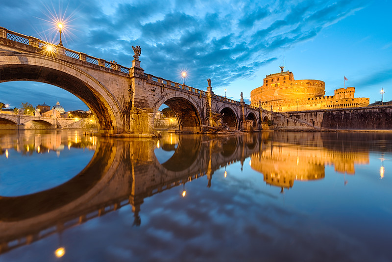 A perfect moment of beautiful cloudy twilight over Ponte Sant Angelo in Rome, Italy. A perfect moment of beautiful cloudy twilight over Ponte Sant Angelo in Rome, Italy.